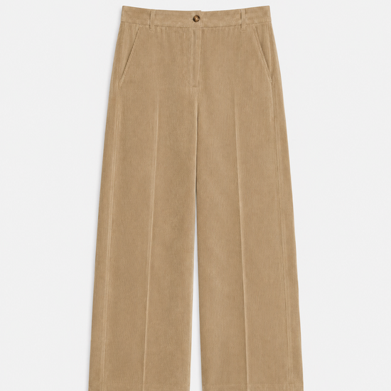 flat lay of cord trousers in a barrel shape on a plain background 
