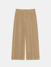 flat lay of cord trousers in a barrel shape on a plain background 