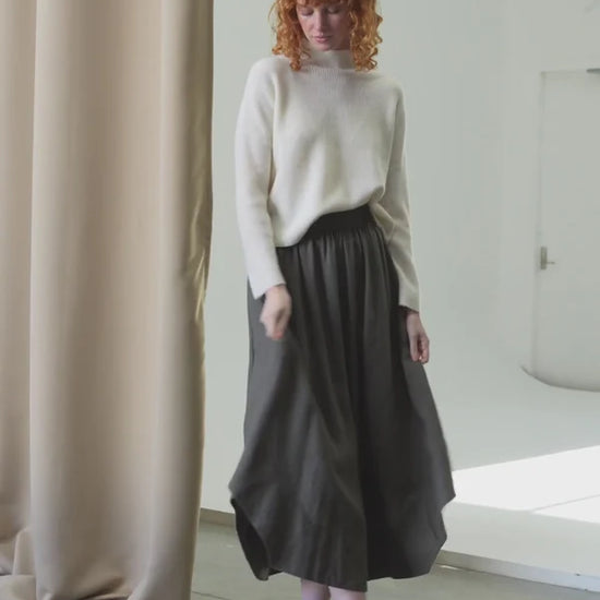 white ribbed jumper with stand neck and long sleeves model shot