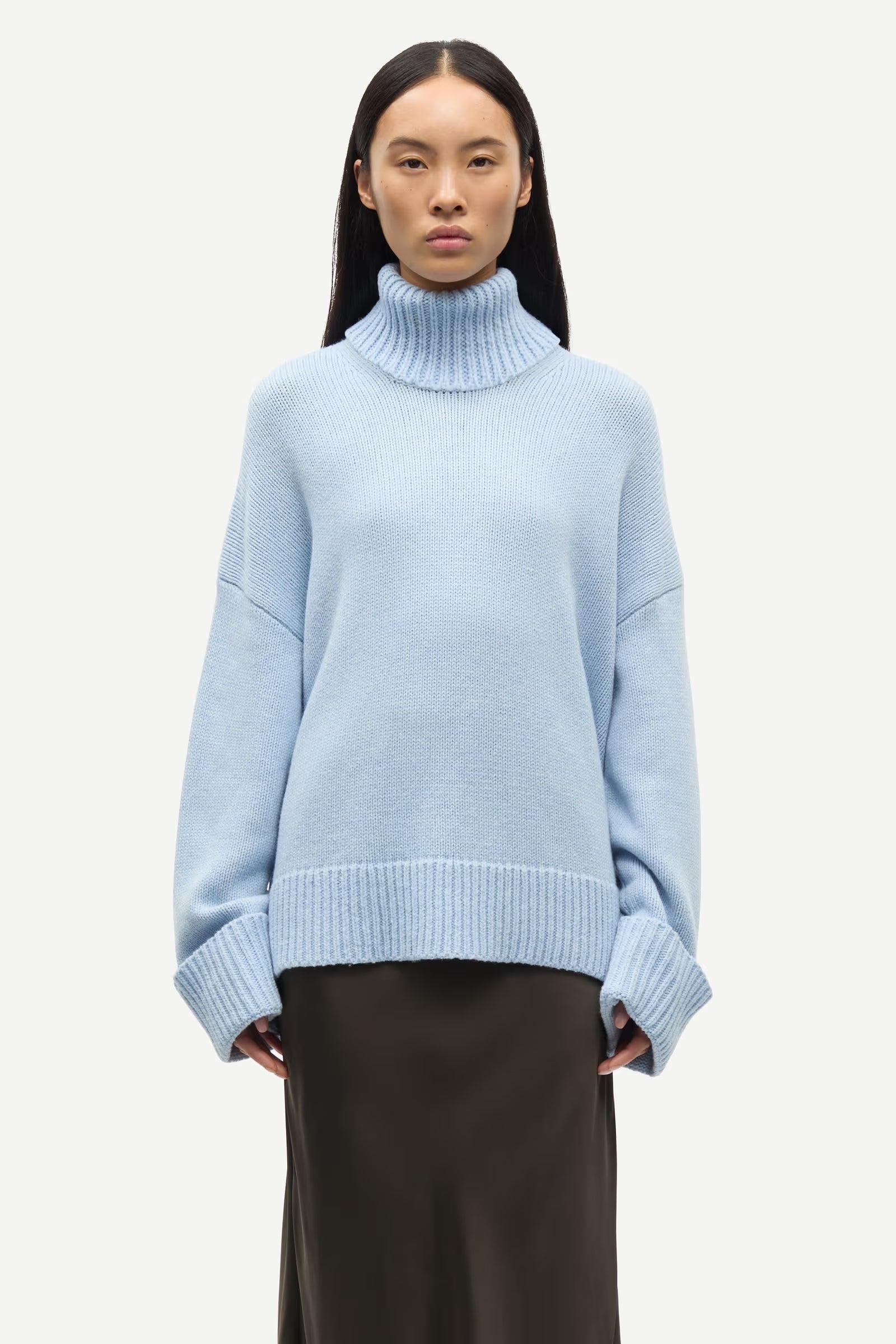 turtleneck heavy knit jumper with ribbed edging and a light blue hue from samsoe samsoe model shot