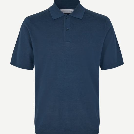 Blue polo shirt on a white background
