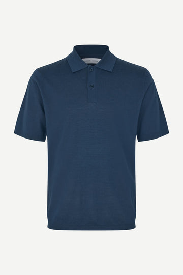 Blue polo shirt on a white background