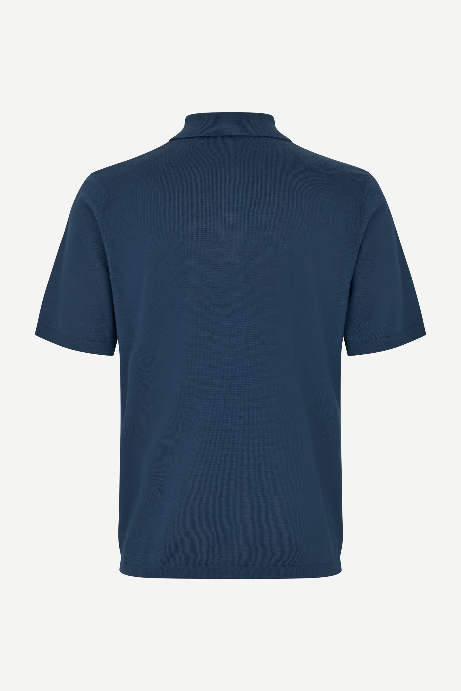 Navy blue polo shirt on a white background