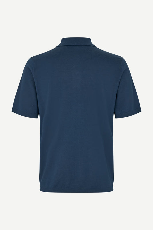 Navy blue polo shirt on a white background