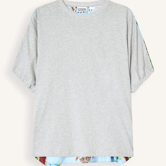 A light gray short-sleeve t-shirt with a colorful patterned hem and matching patterned sleeve cuffs, displayed flat against a light cream background.