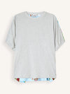 A light gray short-sleeve t-shirt with a colorful patterned hem and matching patterned sleeve cuffs, displayed flat against a light cream background.