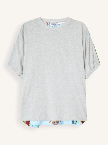 A light gray short-sleeve t-shirt with a colorful patterned hem and matching patterned sleeve cuffs, displayed flat against a light cream background.