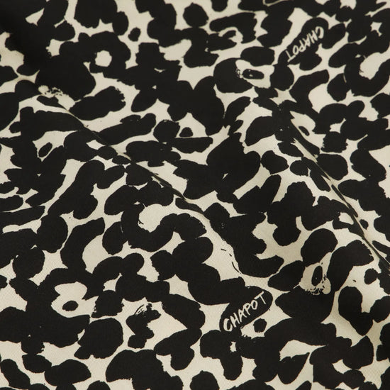 Classic shirt with full length covered placket in a black and ecru animal print