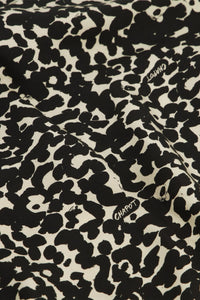 Classic shirt with full length covered placket in a black and ecru animal print