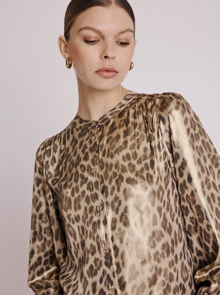 Close up view of Long sleeved leopard print shirt  detailing the neckline 