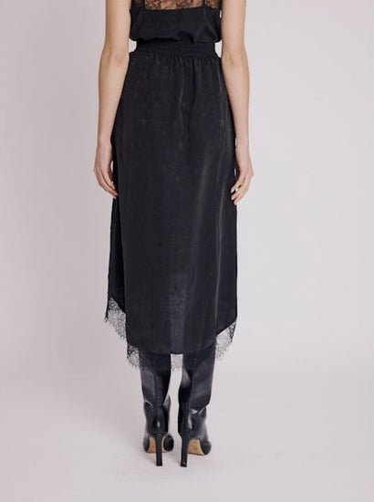 Black mid-length skirt with delicate lace trim and tone on tone star design rear view