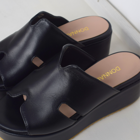 Black sandals with a large platform 