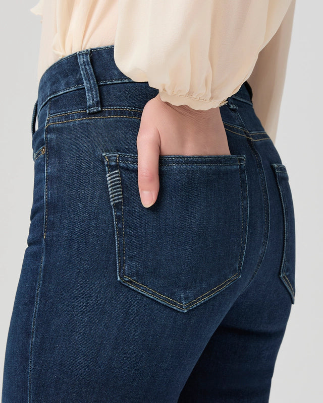 close up of pocket detail on boot cut blue denim jeans from paige