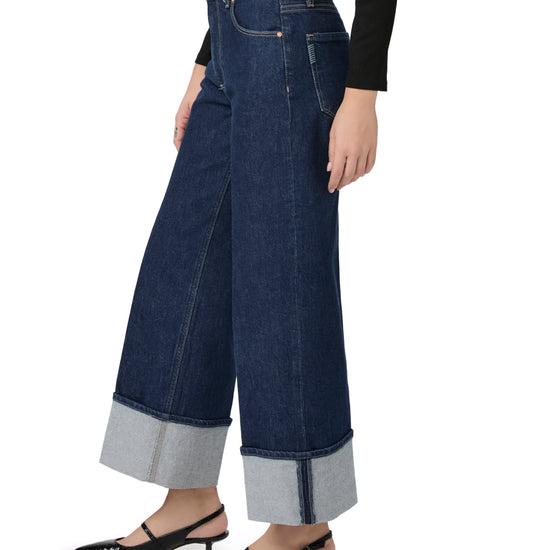 wide leg turn up dark blue jeans  side view 