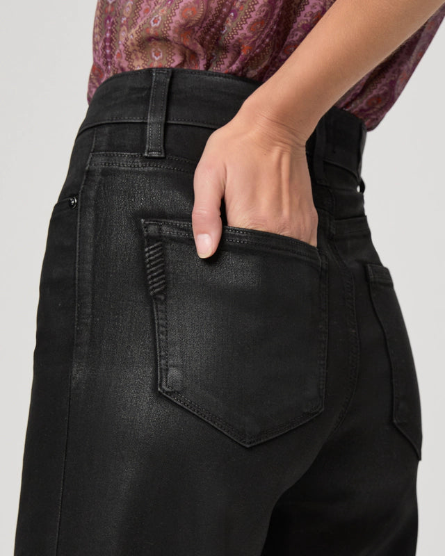 Close up pocket detail on black wax look jeans