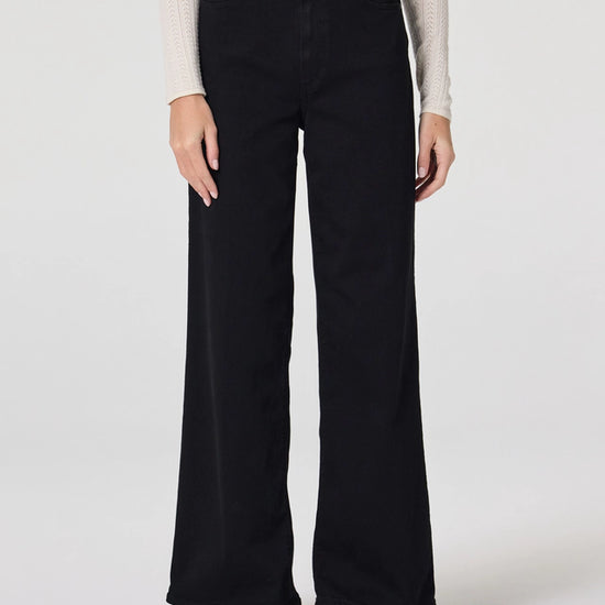 Close up of black wide leg jeans from Paige