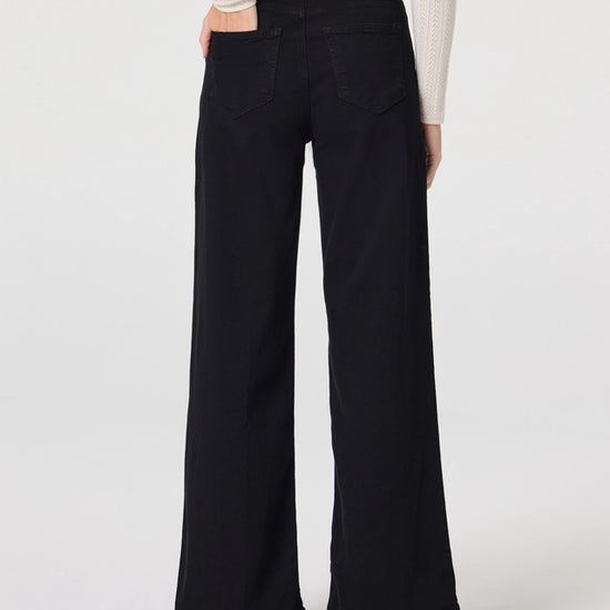 Rear view of black wide leg jeans from Paige