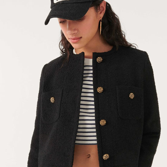 Cropped woven black jacket with two front chest patch pockets and gold buttons