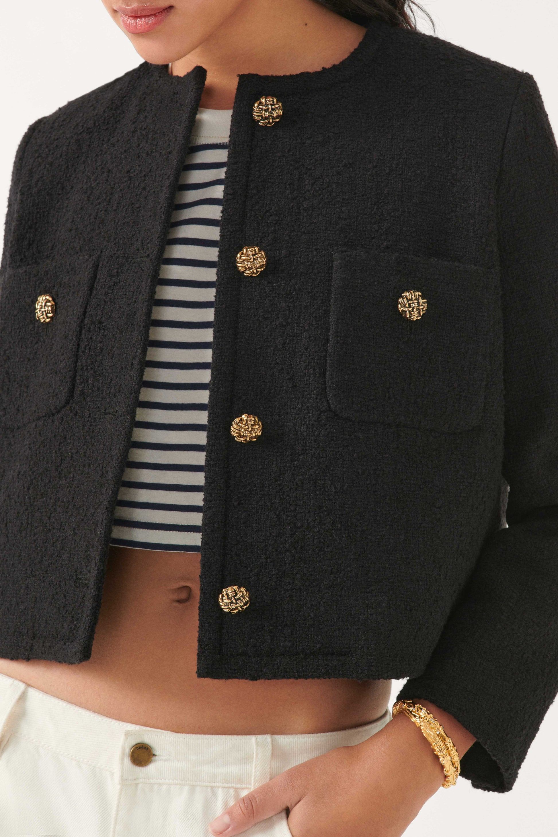 Cropped woven black jacket with two front chest patch pockets and gold buttons