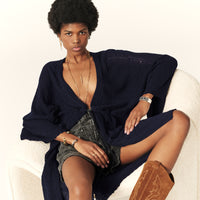 Navy fine knit pointelle stitch long line cardigan with drawstring waist and scalloped edges