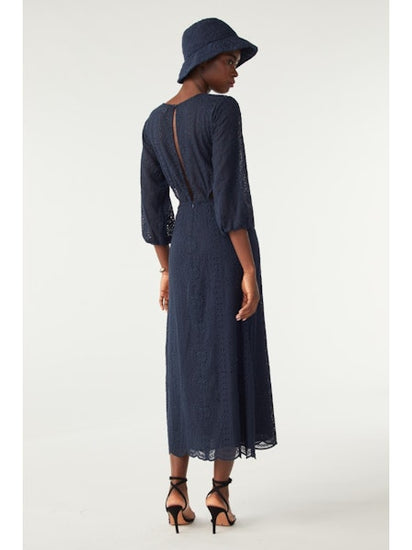 Navy midi dress with three quarter length sleeves waist cut outs and open back and scalloped hem with broderie anglais throughout