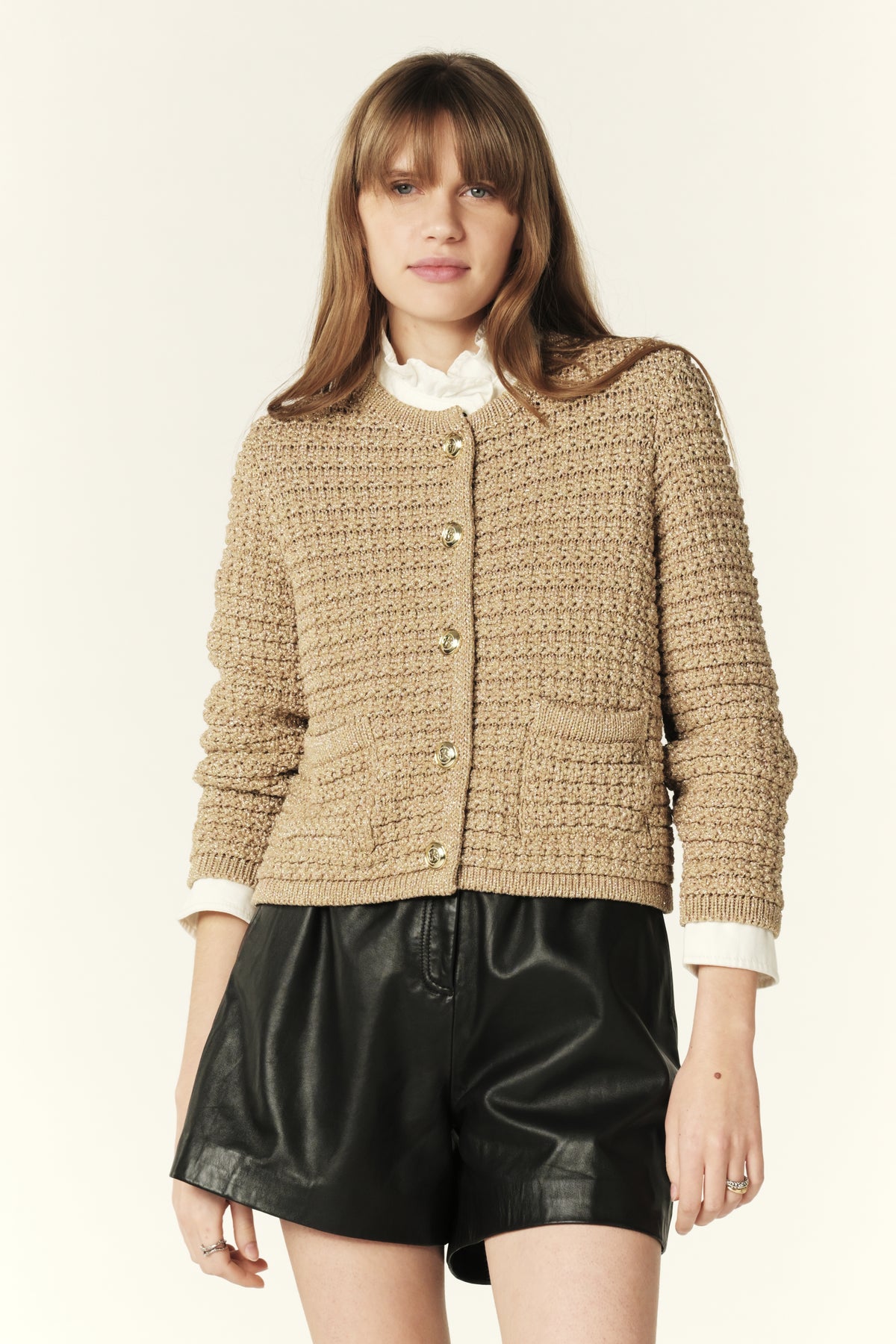 Crewneck gold metallic cardigan with two front patch pockets and gold button fastening
