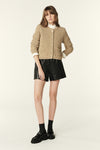 Crewneck gold metallic cardigan with two front patch pockets and gold button fastening