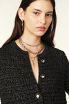 Crewneck black and silver metallic cardigan with two front patch pockets and gold and black enamel button fastening
