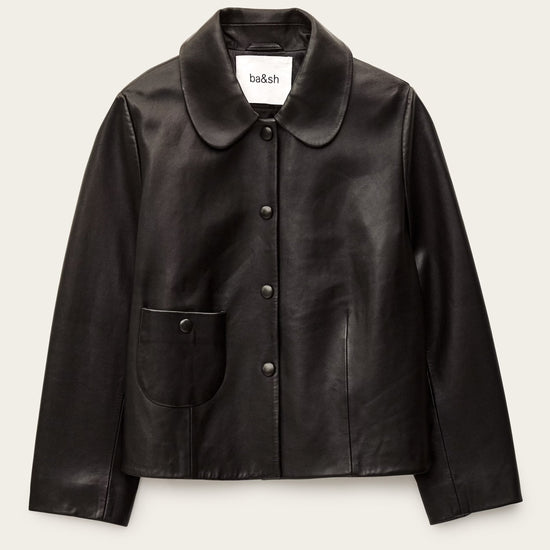 Black leather jacket on a beige background