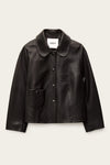 Black leather jacket on a beige background