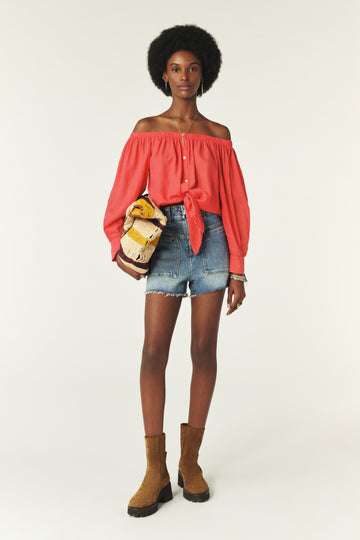 Coral coloured cotton shirt to be worn off the shoulder with a tie front