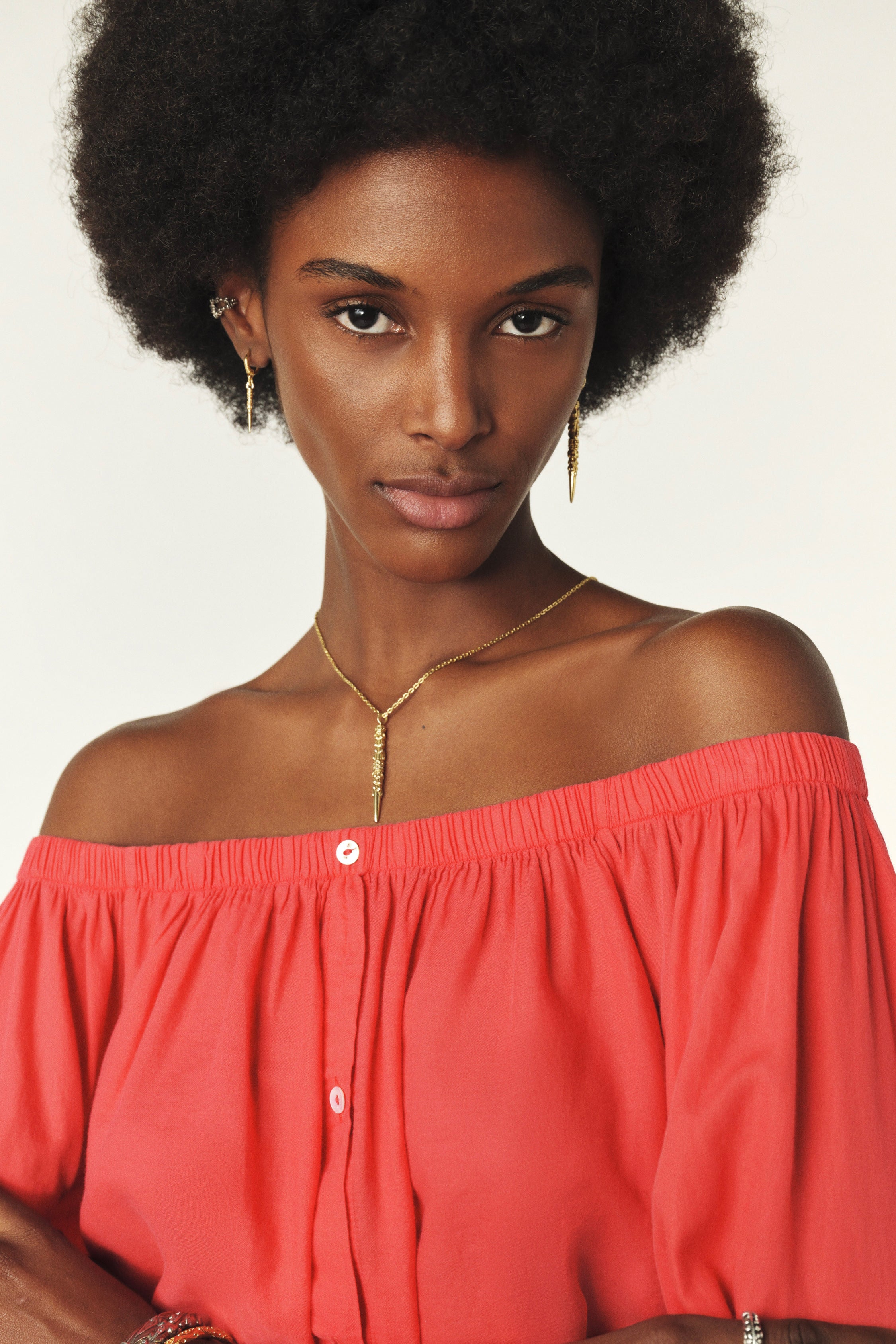 Coral coloured cotton shirt to be worn off the shoulder with a tie front