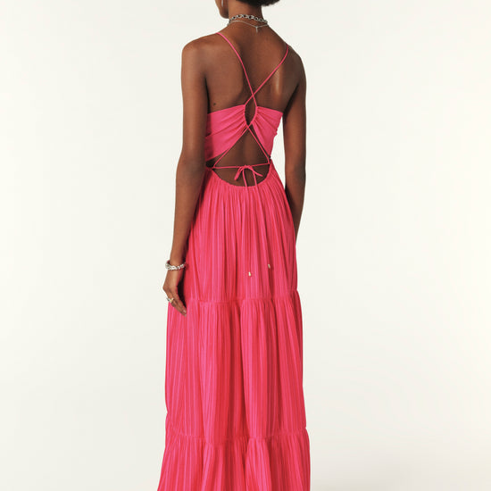 Fuchsia pink maxi dress with a deep v neckline and spaghetti straps that lace up the back