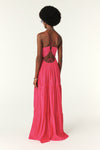 Fuchsia pink maxi dress with a deep v neckline and spaghetti straps that lace up the back