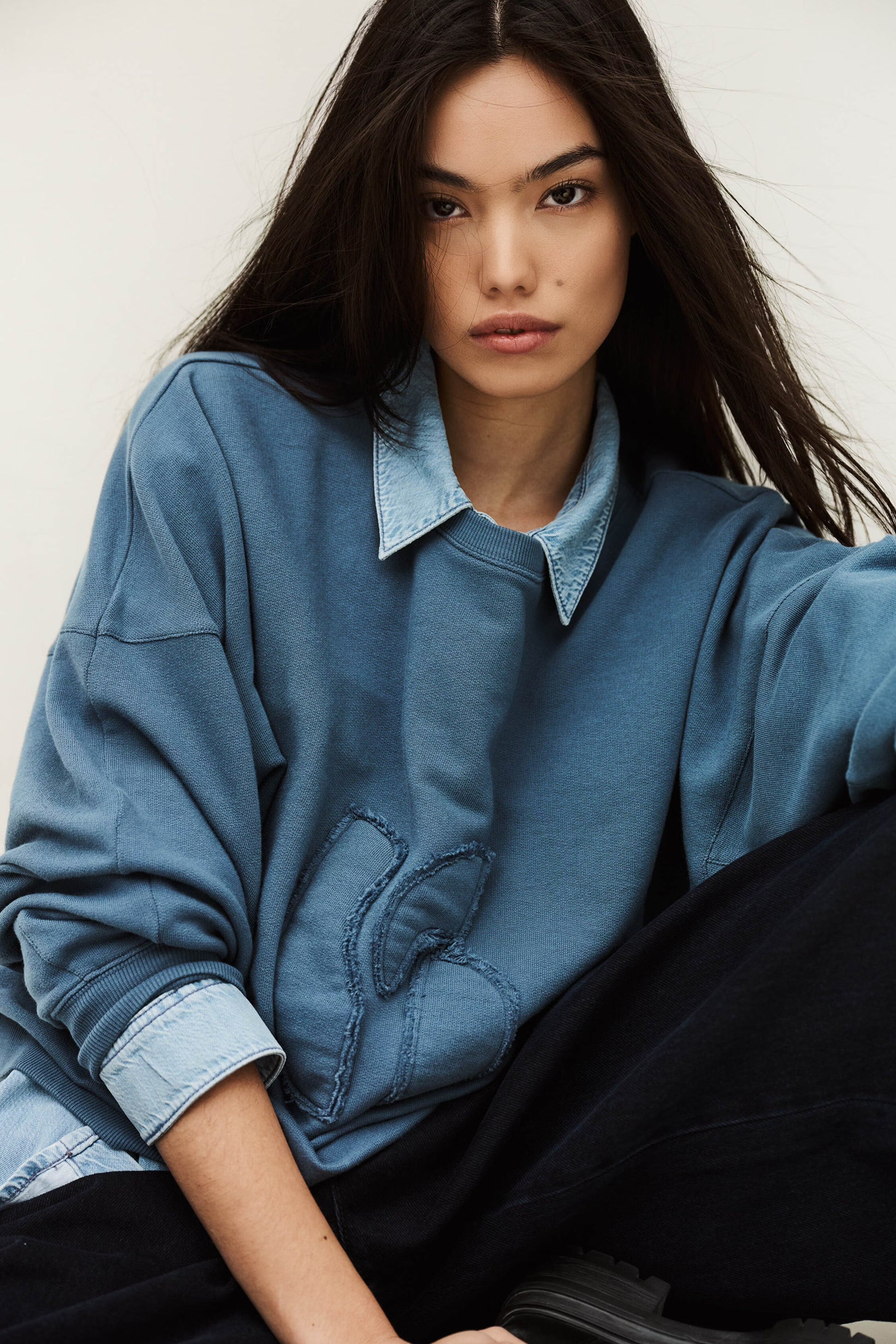 Blue sweatshirt layered over blue shirt