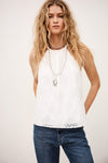 White top with lace details on model worn with jeans from ba&sh