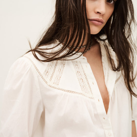 Close up of white short sleeve shirt from ba&sh