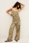 Woman wearing a yellow floral jumpsuit against a white background from ba&sh