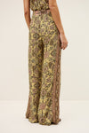 Patterned pants worn by a person on a white background from ba&sh