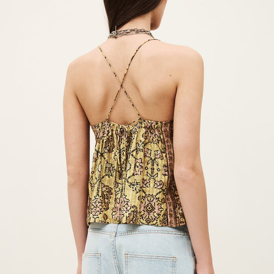 Rear view of yellow top with cross strap back