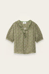 Green floral blouse on a light beige background from ba&sh