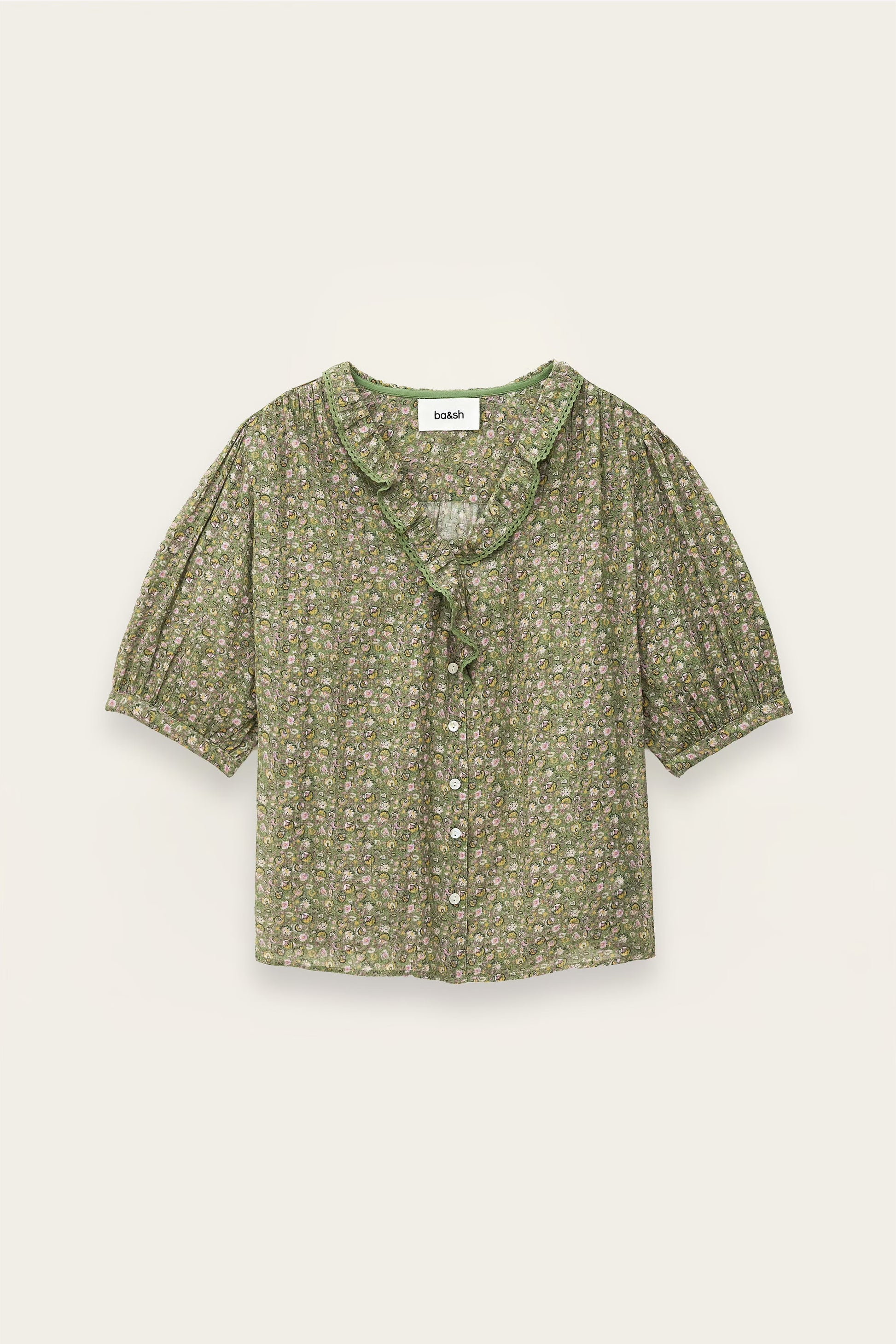 Green floral blouse on a light beige background from ba&sh