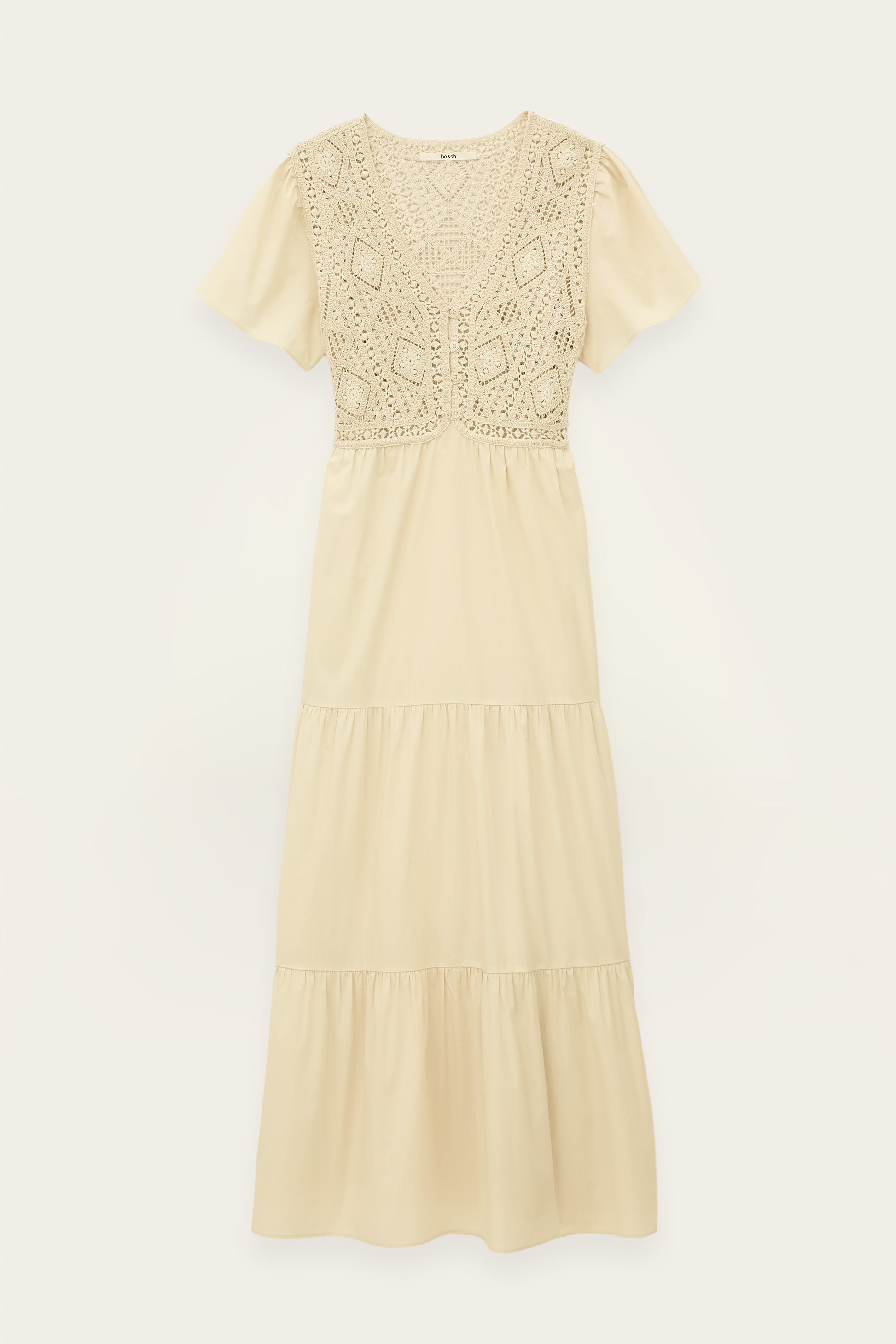 Beige dress with lace detailing on a white background
