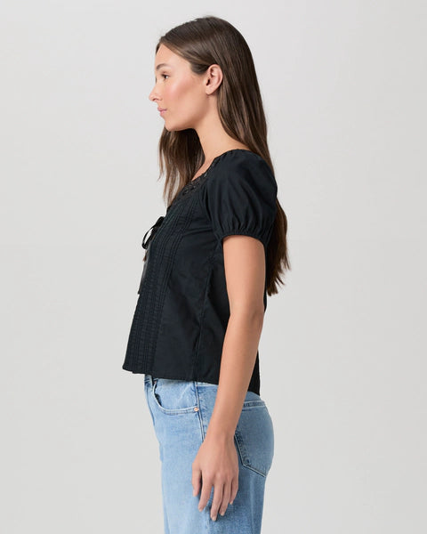 black cotton top with short sleeves, lace detailing and tie at the bust side view