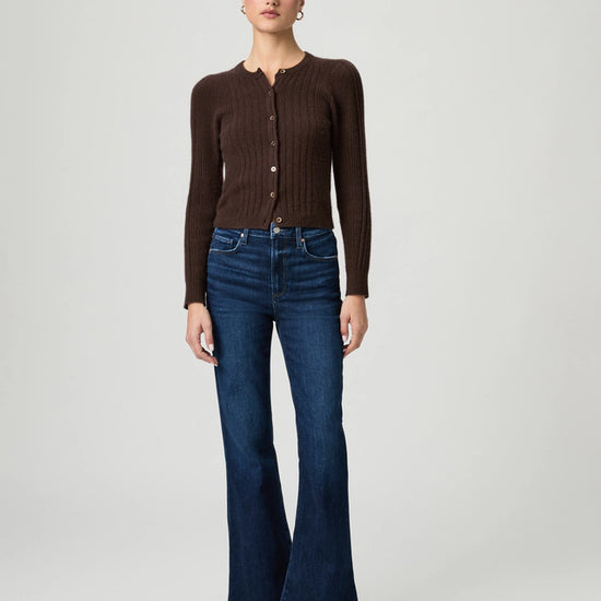 girl wearing blue kick flare jeans with brown cardigan and ballet flats from paige