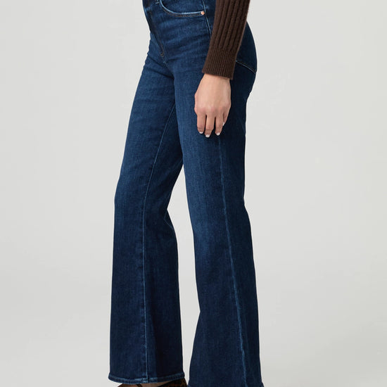 Side view of blue kick flare denim