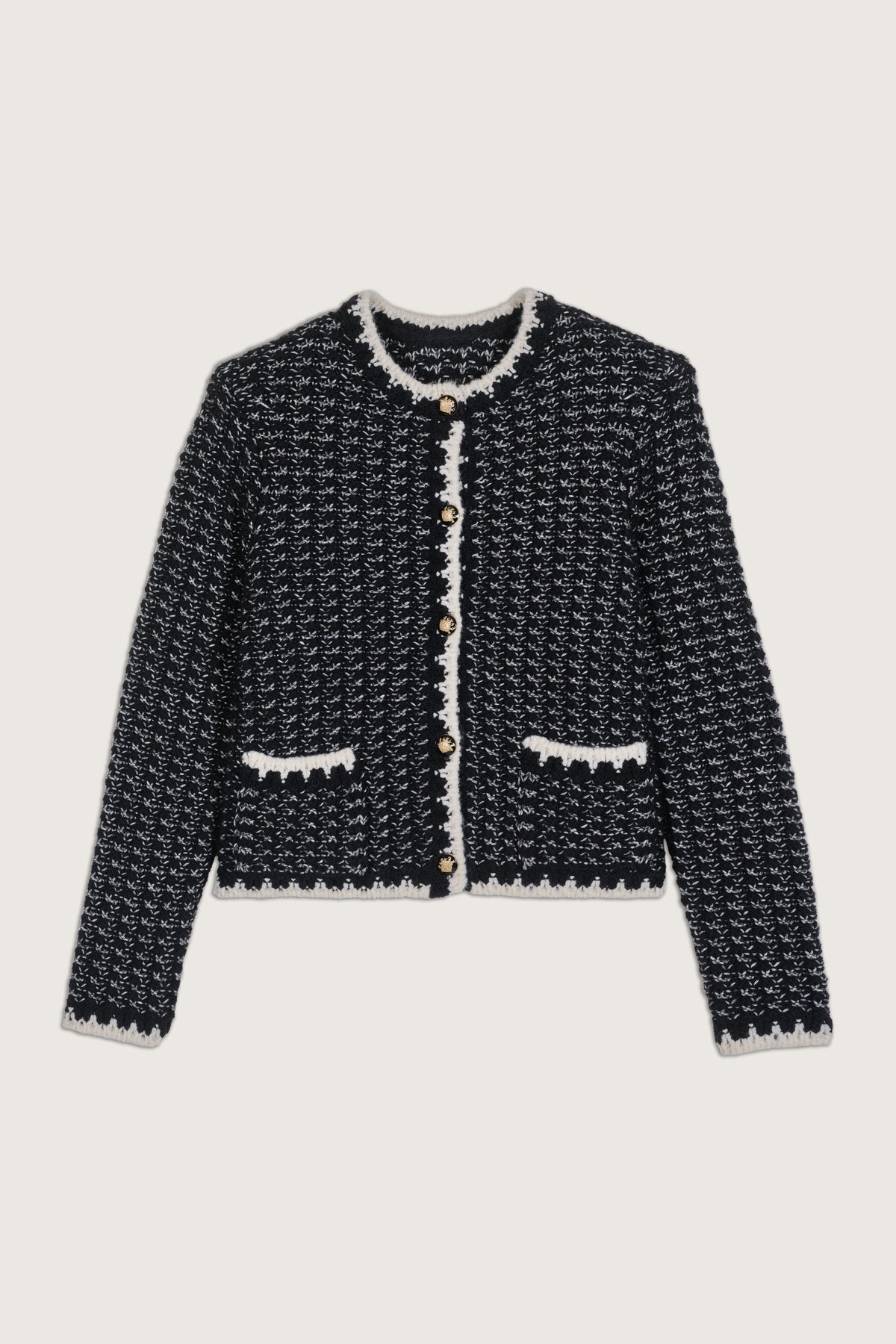 Knitted black and white crew neck cardigan with contrast edging and black and gold metallic buttons