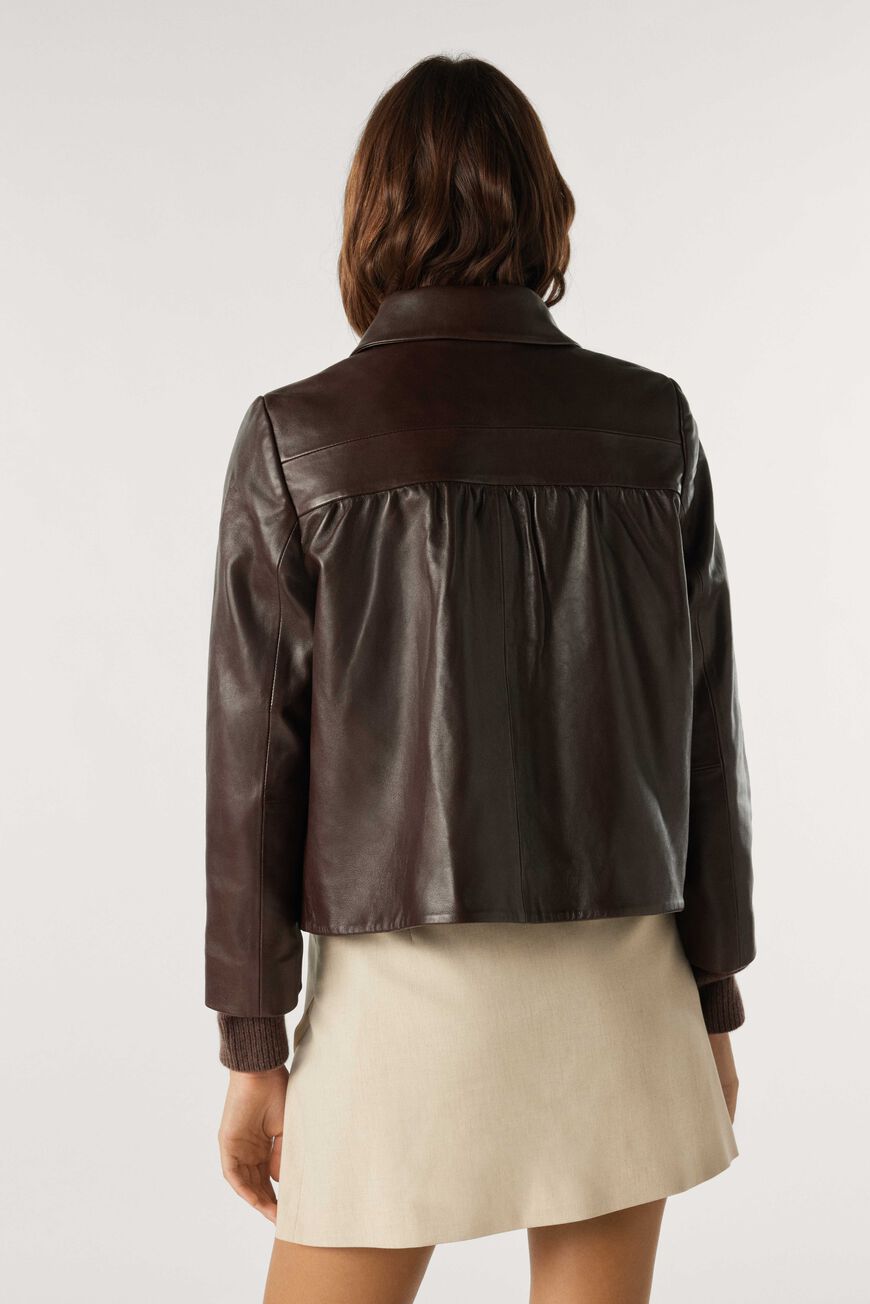 Cropped brown leather jacket with peter pan collar and popper fastening with patch pocket