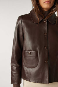 Cropped brown leather jacket with peter pan collar and popper fastening with patch pocket