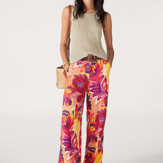 Bright purple, pink, orange and yellow wide leg trousers